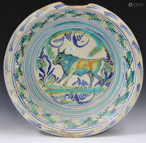 A large Spanish pottery basin or bowl, Talavera or Puente del Arzobispo, 19th century, painted to