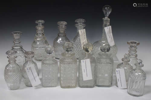 Fourteen assorted cut glass decanters and twelve stoppers, late 18th century and mostly 19th