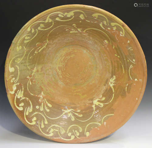 A large Spanish terracotta pottery bowl of flared circular form, late 19th/early 20th century,