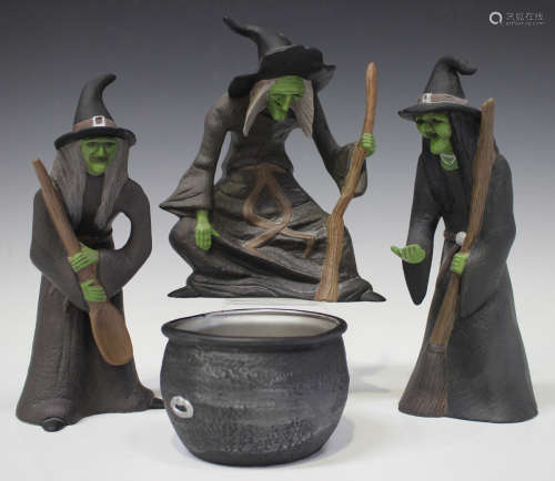 Three Brian Wood studio pottery witches and a cauldron, contemporary, each witch with green face and