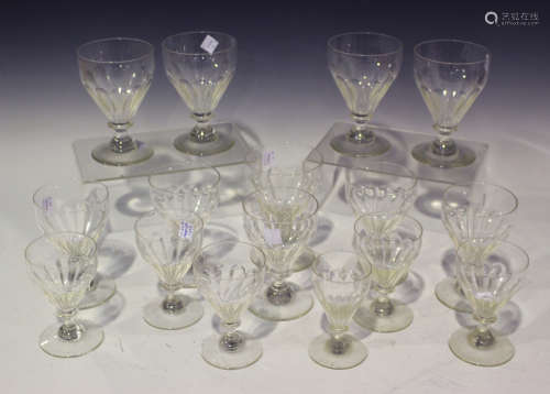 A part suite of glasses, early 20th century, each with panel cut bowl, comprising five red wine,