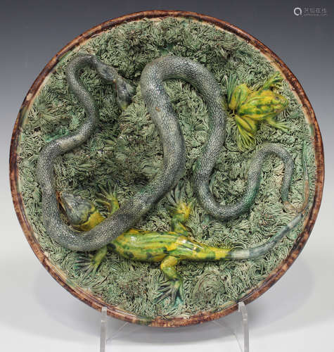 A Jose Francisco de Sousa majolica Portuguese Palissy Ware dish, 1860-93, applied with a long grey