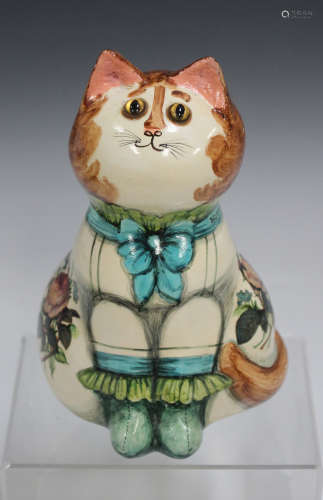 A Joan and David de Bethel Rye Pottery figure of a seated cat, dated 1969, its blue ribbon collar