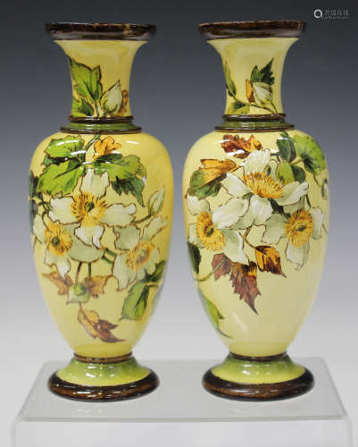 A pair of Doulton faience pottery vases, circa 1882, each ovoid body decorated by Mary M. Arding,