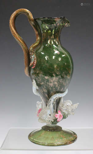 A Salviati type Italian glass ewer, late 19th/early 20th century, the green body with aventurine