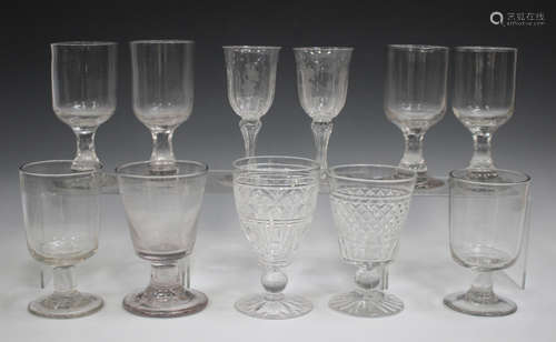 A small group of drinking glasses, 19th century and later, including a pair of wines with faceted