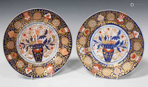 A pair of English porcelain Imari palette plates, probably Coalport, circa 1820, each with a central