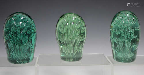 Three soda glass dump paperweights, 19th century, each with internal bubble decoration, height of