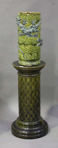 A Burmantofts Faience jardinière stand, late 19th century, of column shape, relief decorated with