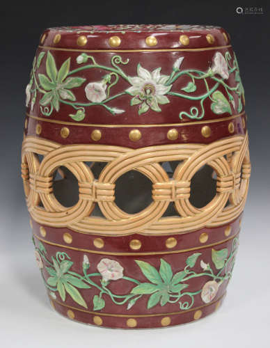 A Minton majolica barrel shaped garden seat, circa 1870, the pierced sides moulded with enamelled