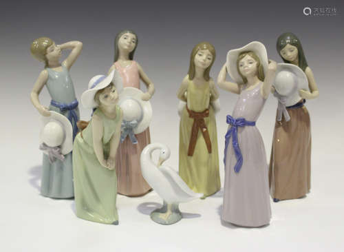 Six Lladro porcelain figures of young women with hats, including Naughty Girl, No. 5006, Bashful,