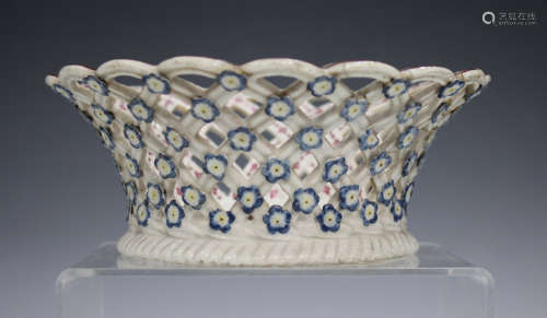 A Chelsea porcelain basket, circa 1756, of circular form, the everted sides pierced with basketwork,