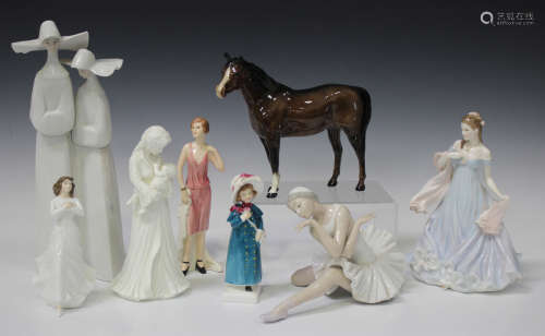 Two Lladro figures, comprising The Death of the Swan, No. 4855, and Nuns, No. 4611, together with