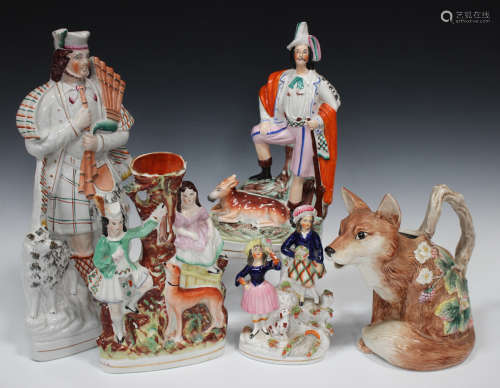 A group of decorative ceramics, late 19th and 20th century, including a large Staffordshire figure