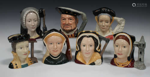 Seven Royal Doulton large character jugs, modelled as Henry VIII and his six wives.Buyer’s Premium