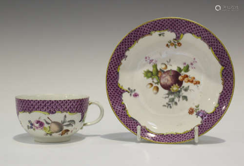 A Meissen porcelain cabinet cup and saucer, late 18th century, painted with fruit, flowers, nuts and