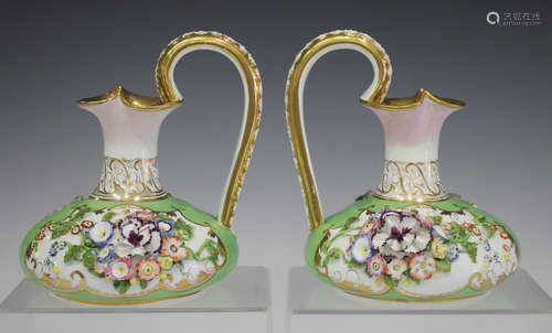 A pair of Bloor Derby floral encrusted green ground jugs, circa 1820-40, each bulbous body beneath a