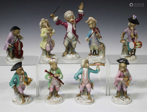A nine-piece Volkstedt porcelain Meissen style monkey band, early 20th century, comprising eight