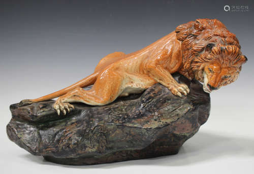 A Royal Doulton Prestige figure Lion on Rock, HN2641, designed by Noke, green printed factory