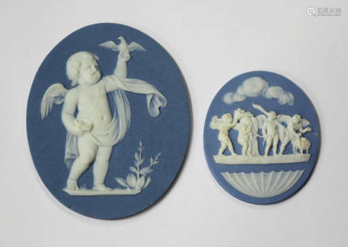 Two Wedgwood pale blue Jasperware oval plaques, late 18th/early 19th century, the first sprigged