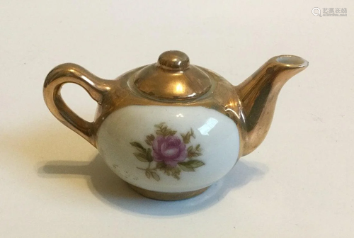 vintage small porcelain golden teapot