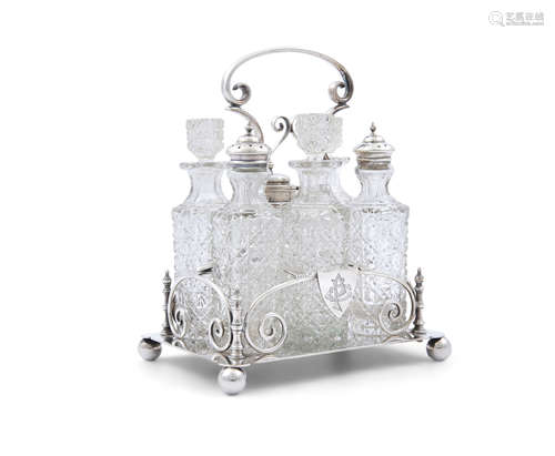 AN EDWARDIAN SILVER SIX BOTTLES CONDIMENTS SET, Sheffield 1903, of rectangular shape with raised