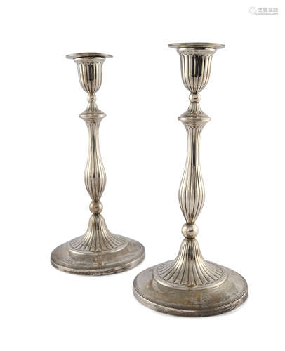 A PAIR OF GEORGE III SILVER CANDLESTICKS, Sheffield 1794, mark of John Green & Co., with urn