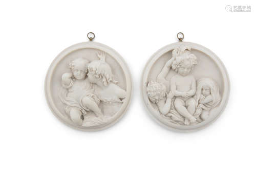 A PAIR OF VICTORIAN CIRCULAR MARBLE PLAQUES, carved in high relief with figures of children playing,