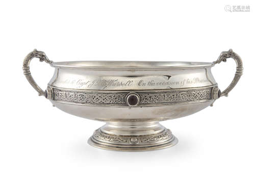 A CELTIC REVIVAL SILVER TWO-HANDLED CIRCULAR DISH, Dublin 1925, mark of West & Sons, engraved with