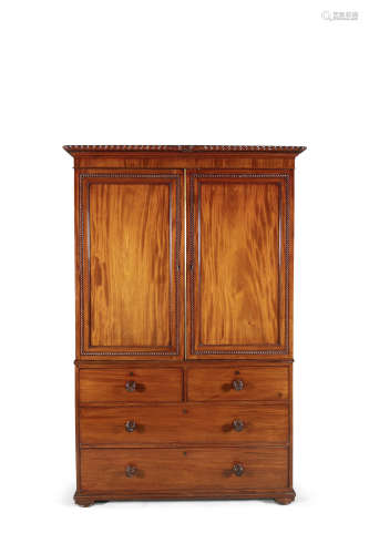 A GEORGE IV MAHOGANY LINEN PRESS, of rectangular shape, the outset cornice with gadroon edge above