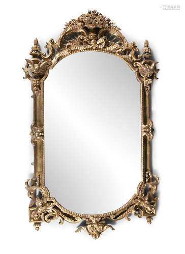 A LARGE CONTINENTAL CARVED GILTWOOD PIER MIRROR, fitted with bevelled glass plate, surmounted with