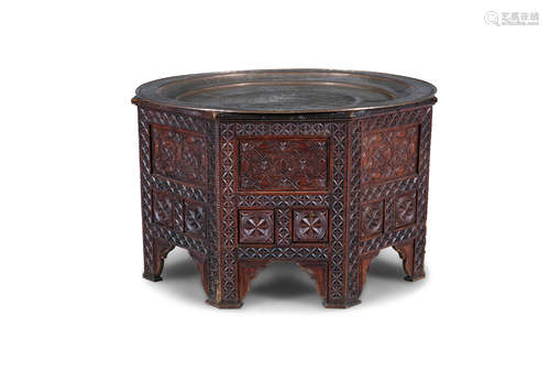 A LARGE MIDDLE EASTERN BENARES COPPER TOPPED CENTRE TABLE, raised on a timber base, measuring 58