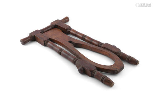 A VICTORIAN MAHOGANY BOOT JACK, 55 cm high, 33 cm wide