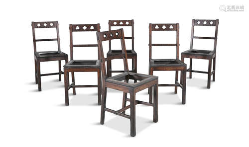 A SET OF SIX ARTS AND CRAFTS OAK FRAMED SIDECHAIRS, in the style of Pugin. Each with pierced back