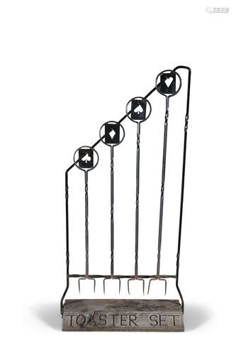 A SET OF FOUR WROUGHT IRON TOASTING SET, comprising four two-pronged toasting forks, each with