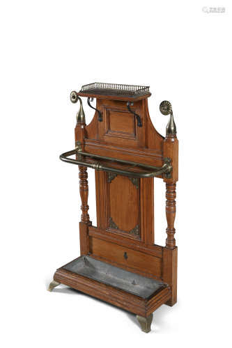 A VICTORIAN OAK AND BRASS MOUNTED HALL STAND, c.1880, attributed to Shoolbred with brass rosette