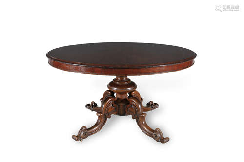 A VICTORIAN MAHOGANY CIRCULAR DINING TABLE, with thumb moulded rim and raised on baluster turned