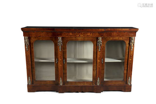 A 19TH CENTURY BREAKFRONT WALNUT CREDENZA, the moulded top about three glazed doors opening to