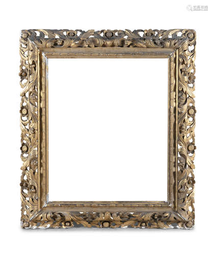 A LARGE GILTWOOD AND GESSO FLORENTINE PICTURE FRAME, with two borders of foliate carving, the