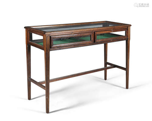 A 20TH CENTURY CURIO TABLE, of rectangular form, the glazed top and sides, raised on slender