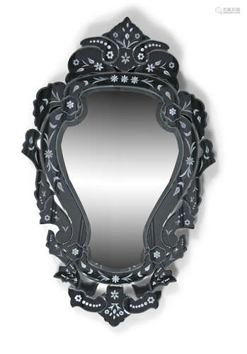 A MODERN VENETIAN STYLE ETCHED GLASS WALL MIRROR, the central baluster form plate enclosed within