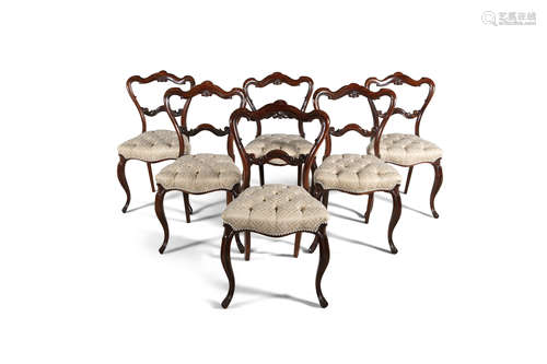 A SET OF SIX VICTORIAN ROSEWOOD BALLOON BACK DINING CHAIRS, the seats upholstered in cream damask