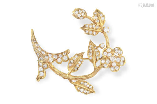A DIAMOND FLOWER BROOCH, the stylised flower with textured gold stem, the petals and leaves set with