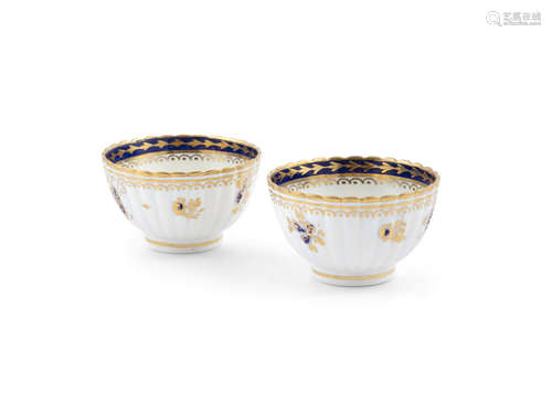 A PAIR OF SALOPIAN GILT DECORATED TEA BOWLS, Caughley 18th century, each with gilt wavy rim and