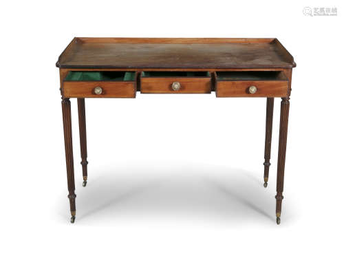 A GEORGE IV MAHOGANY SIDE TABLE, the rectangular top with gallery, above three frieze drawers,