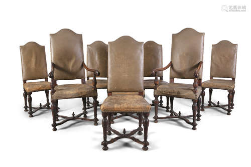 A SET OF EIGHT OAK FRAMED UPHOLSTERED CHAIRS, in the Dutch 17th century style, each with arched