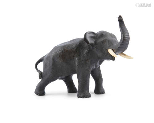 A JAPANESE BRONZE MODEL OF AN ELEPHANT, c.1900, signed. 14cm high
