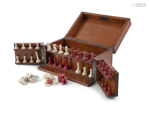 A MAHOGANY GAMES BOX INCLUDING IVORY CHESS SET ETC.