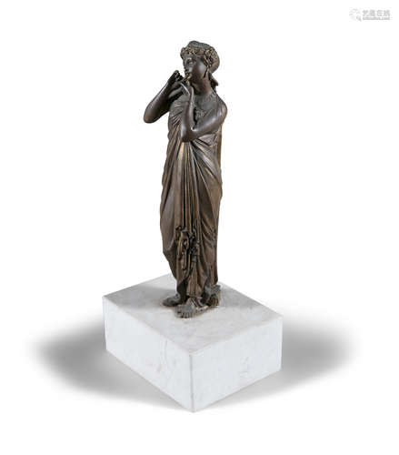 A BRONZE SCULPTURE OF A LADY, on white marble base