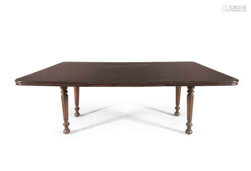 A WILLIAM IV MAHOGANY EXTENDING DINING TABLE, of rectangular form, with rounded corners and